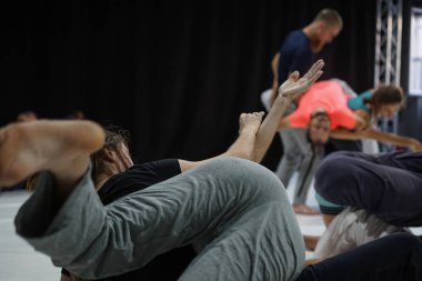 dancer foot, hand  contacting, subject intentionally out of focus