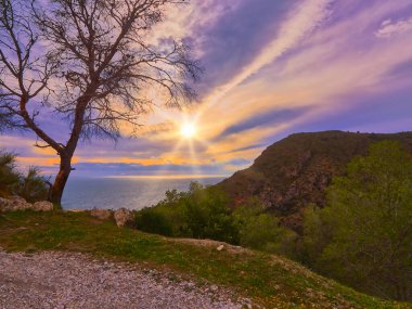 walking on the hill of Granada coast in the afternoon with good weather and with the ocean in sight