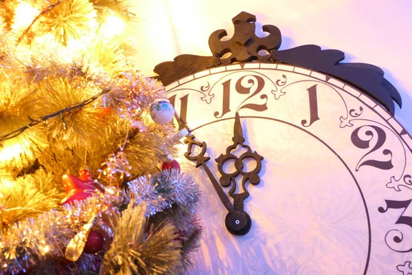 Vintage Clock showing midnight and a Christmas Tree with Decorat — Stock Photo, Image