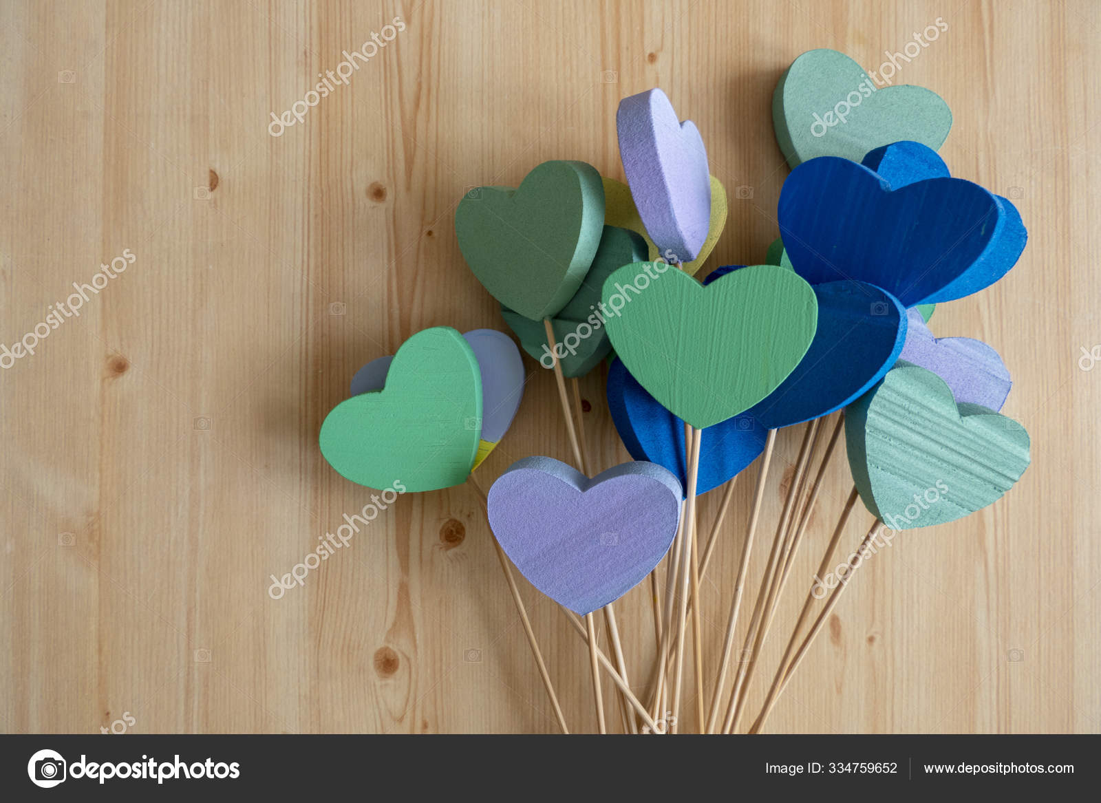 Colorful Styrofoam Hearts on sticks on a Wooden Background Stock Photo by  ©Imagesto 334759652