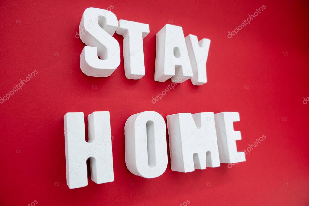 Stay Home appeal volumetric concrete Letters isolated on a plain one color Background