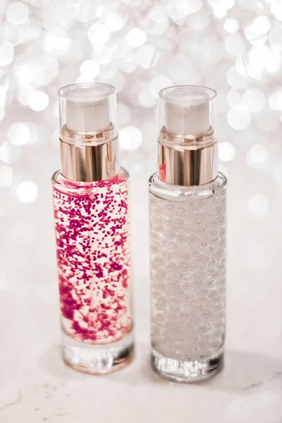 Holiday make-up base gel, serum emulsion, lotion bottle and silv