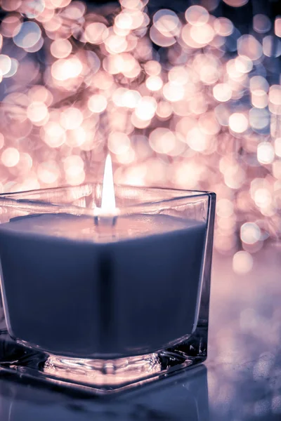 Blue aromatic candle on Christmas and New Years glitter backgrou — Stock Photo, Image