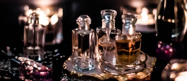 Perfume bottles and vintage fragrance at night, aroma scent, fra — Stock Photo, Image