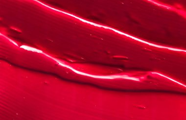 Kırmızı kozmetik doku arka planı, makyaj ve cilt estetiği 