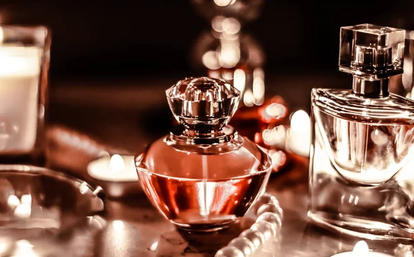 Perfume bottle and vintage fragrance on glamour vanity table at Royalty Free Stock Images