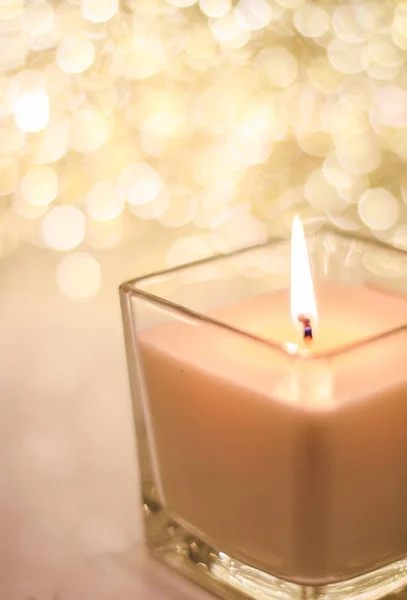 Aromatic candle on golden Christmas and New Years glitter backgr — Stock Photo, Image