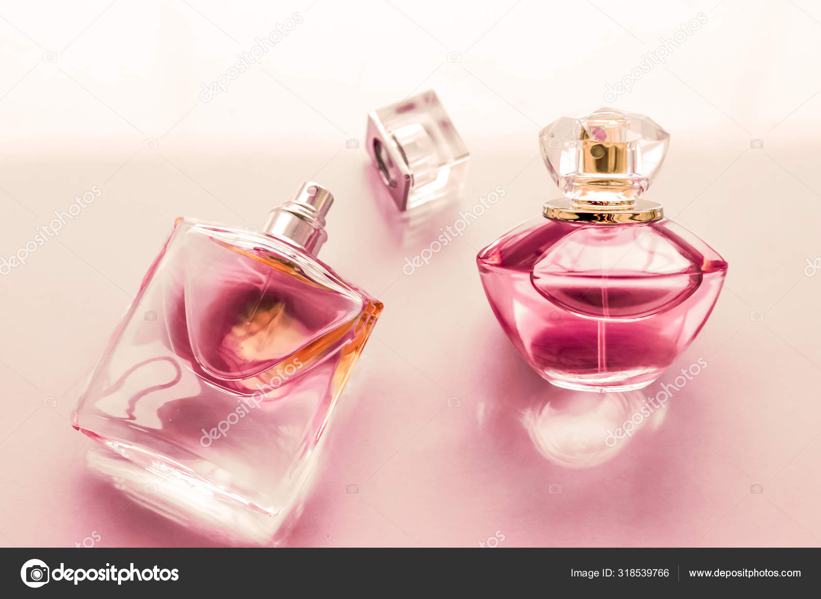 Pink perfume bottle on glossy background, sweet floral scent, glamour  fragrance and eau de parfum as holiday gift and luxury beauty cosmetics  brand design, Stock image