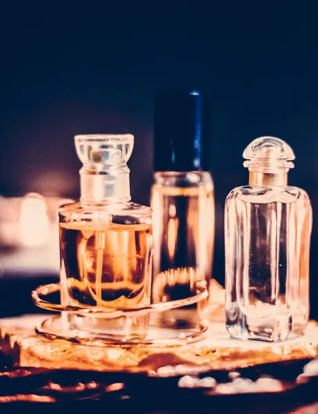Perfume bottles and vintage fragrance at night, aroma scent, fra Stock Picture