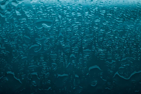 Textura de agua fondo abstracto, gotas de agua sobre vidrio turquesa —  Fotos de Stock