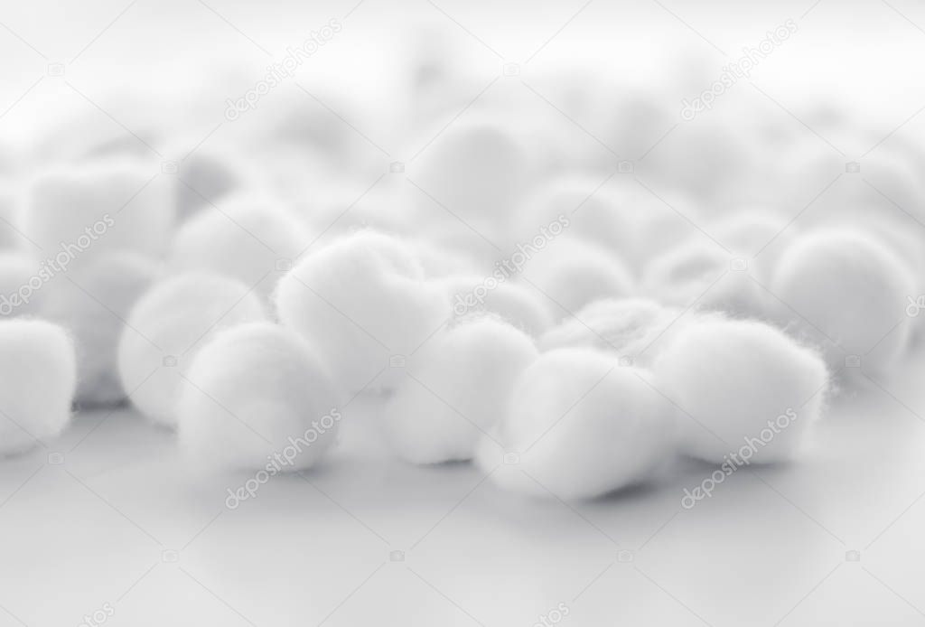 Organic cotton balls background for morning routine, spa cosmeti