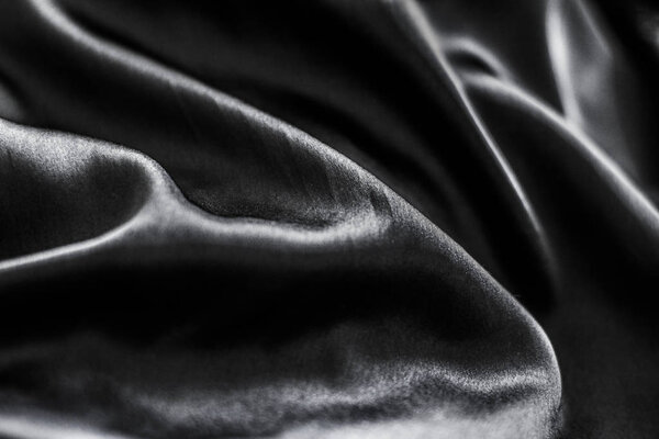 Luxury black soft silk flatlay background texture, holiday glamo