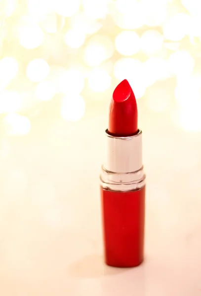 Red lipstick on golden Christmas, New Years and Valentines Day h