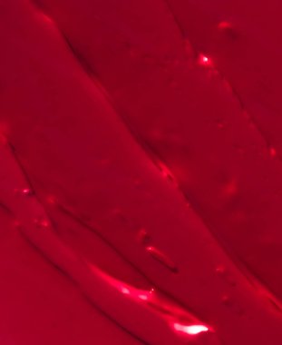 Kırmızı kozmetik doku arka planı, makyaj ve cilt estetiği 