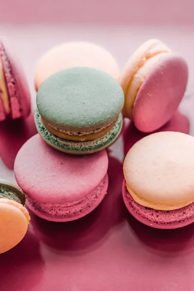 French macaroons on pastel pink background, parisian chic cafe d