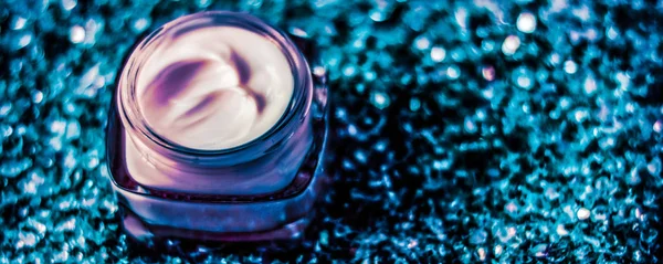 Luxury face cream for healthy skin on shiny glitter background,