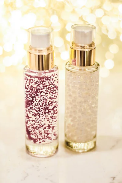 Holiday make-up base gel, serum emulsion, lotion bottle and gold