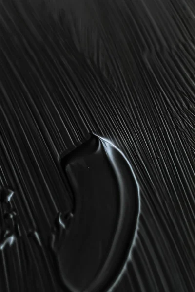 Cosméticos abstrato textura fundo, preto acrílico pintura escova — Fotografia de Stock