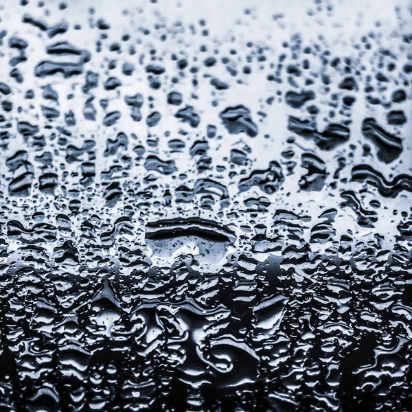 Textura da água fundo abstrato, gotas de água em vidro de prata como — Fotografia de Stock