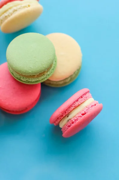 French macaroons on blue background, parisian chic cafe dessert, — ストック写真