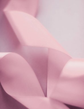 Pembe arka planda soyut ipek kurdele, özel lüks. 