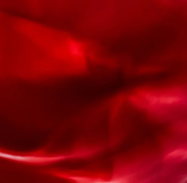 Red abstract art background, silk texture and wave lines in moti — Stock Photo, Image