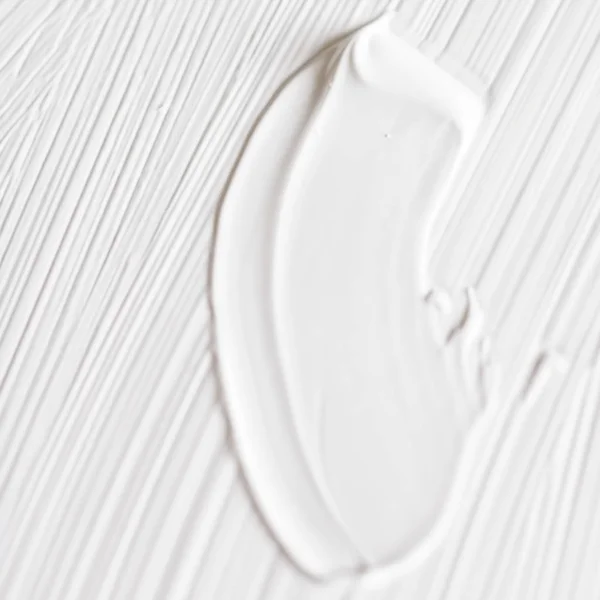 Cosmetics abstract texture background, white acrylic paint brush — Stock Photo, Image