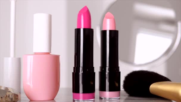 Cosmetics, makeup products on dressing vanity table, lipstick, brush, mascara, nailpolish and powder for luxury beauty and fashion brand ads design — Stock Video
