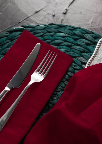 Holiday table setting with red napkin and silver cutlery, food s — Stock Photo, Image