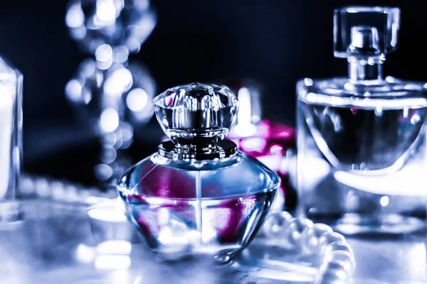 Perfume bottle and vintage fragrance on glamour vanity table at — Stock Photo, Image