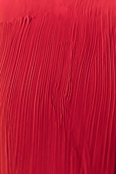 Cosmetics abstract texture background, red acrylic paint brush s