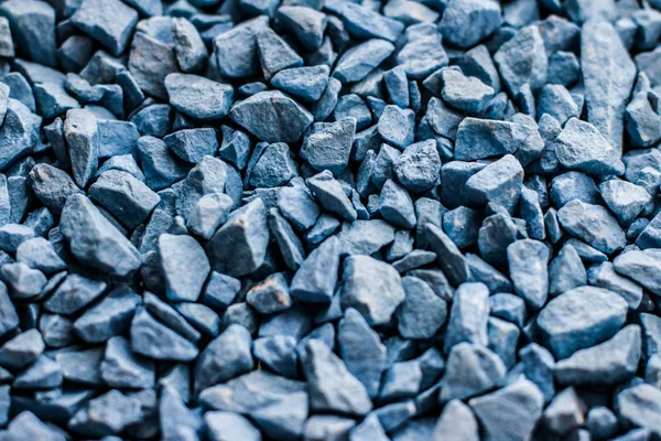 Blue stone pebbles as abstract background texture, landscape arc