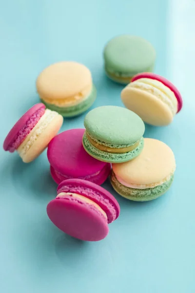 French macaroons on blue background, parisian chic cafe dessert, — ストック写真