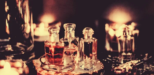 Perfume bottles and vintage fragrance at night, aroma scent, fra — Stock Photo, Image