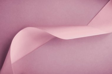 Pembe arka planda soyut ipek kurdele, özel lüks. 