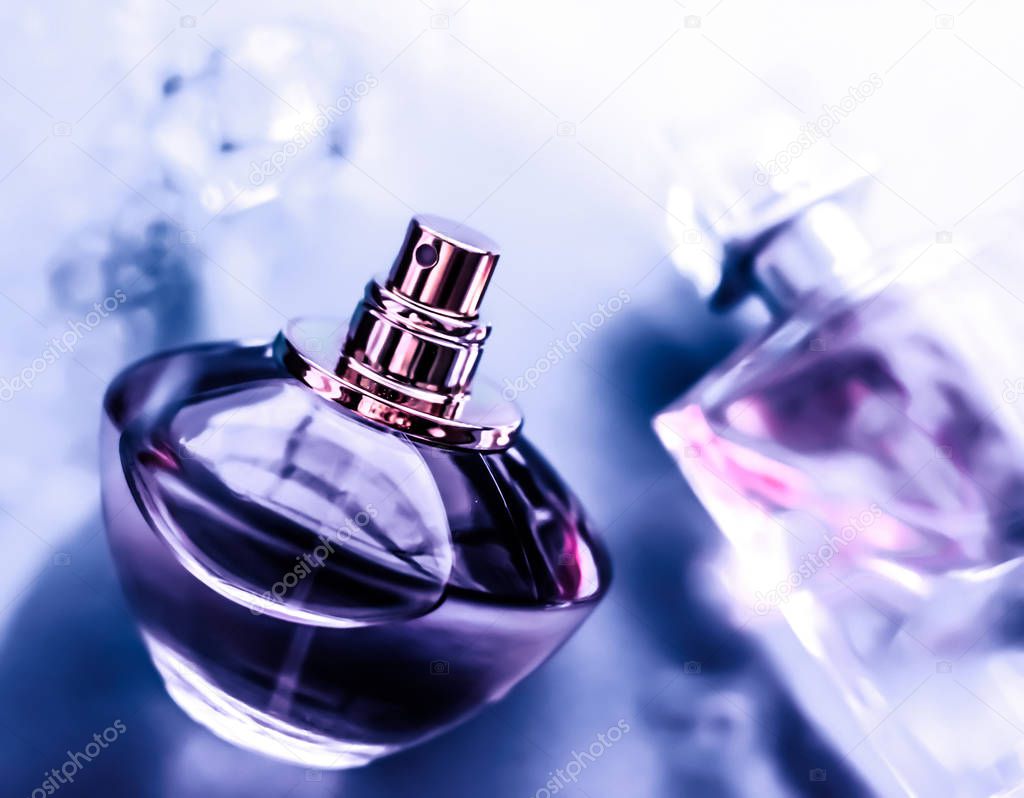 Perfume bottle under purple water, fresh sea coastal scent as gl