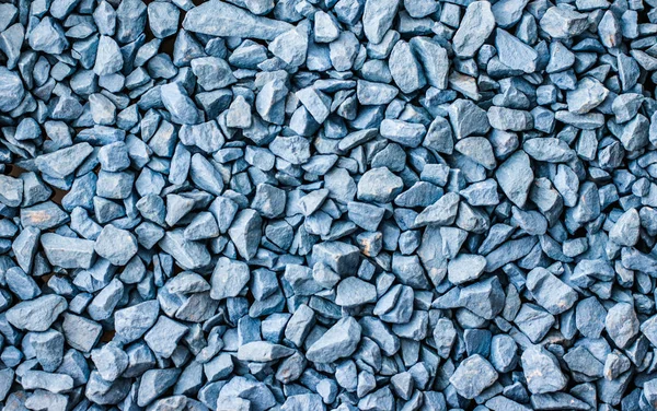 Blue stone pebbles as abstract background texture, landscape arc