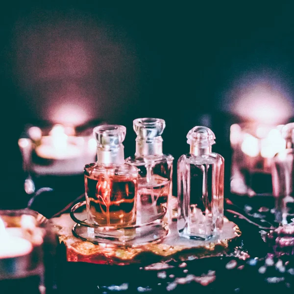 Perfume bottles and vintage fragrance at night, aroma scent, fra — Stock Photo, Image