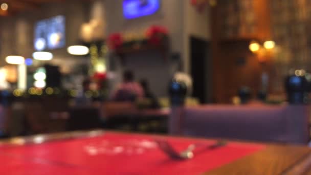 Blurred defocused cafe, coffee shop or restaurant interior background, abstract digital backdrop, blur bokeh for leisure and travel brand design, holiday season vlog — Stock Video