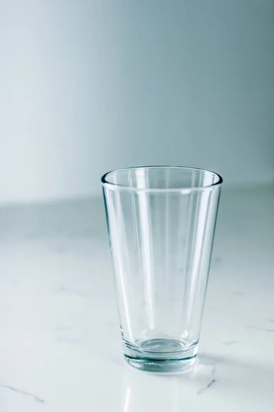 Clean empty glass on marble table — Stock Photo, Image