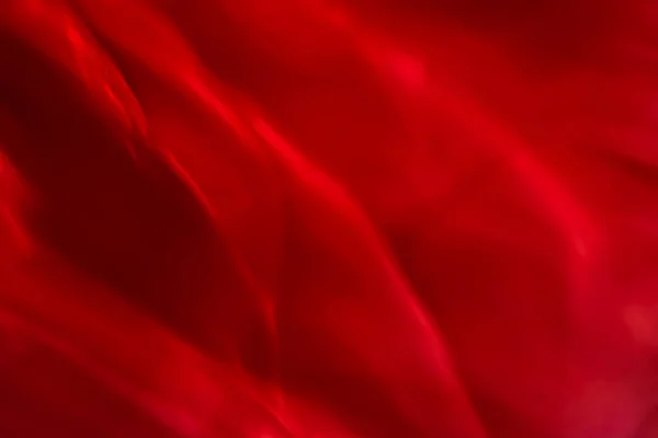 Червоний абстрактний художній фон, шовкова текстура та хвильові лінії в — стокове фото
