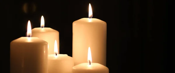 Aromatic vanilla yellow candles set at night, Christmas, New Yea — ストック写真