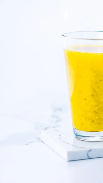 Glass of yellow fruit smoothie juice with chia seeds for diet de — Stock Photo, Image
