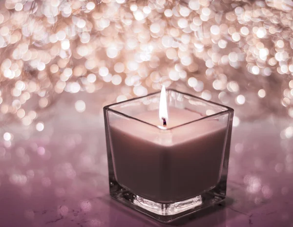 Chocolate aromatic candle on Christmas and New Years glitter bac — Stock Photo, Image