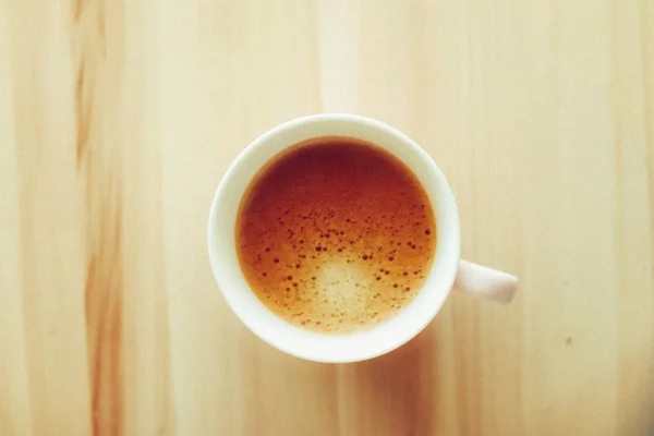 Morning coffee cup with milk on marble stone flat lay, hot drink