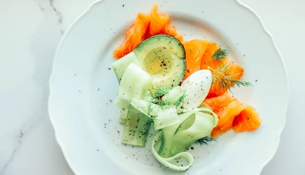 Fresh salmon salad with avocado and creamy mascarpone cheese fla