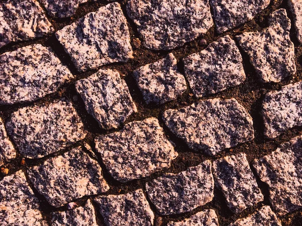 Velho pavimento de pedra rústica fundo texturizado, det arquitectónico — Fotografia de Stock