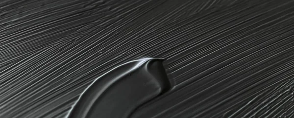 Cosméticos abstrato textura fundo, preto acrílico pintura escova — Fotografia de Stock