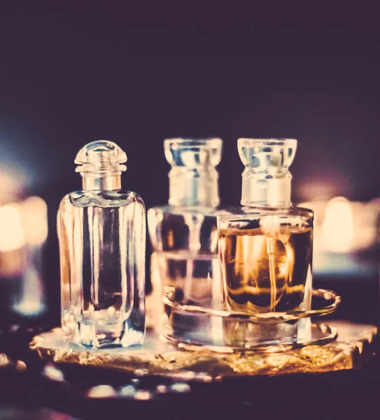 Perfume bottles and vintage fragrance at night, aroma scent, fra Royalty Free Stock Images