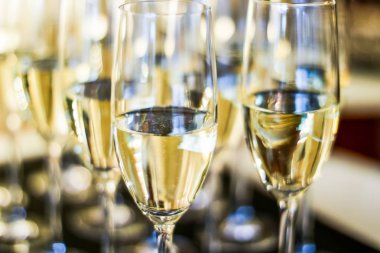 Glasses of champagne and sparkling wine served on a tray during 